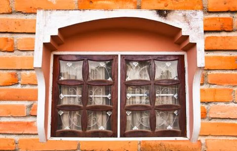 Window on a brick wall. Stock Photos
