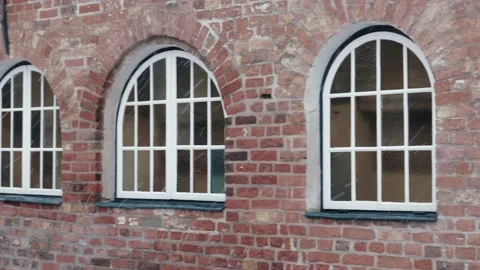 Window in brick wall, snowy winter day Видео 130801903