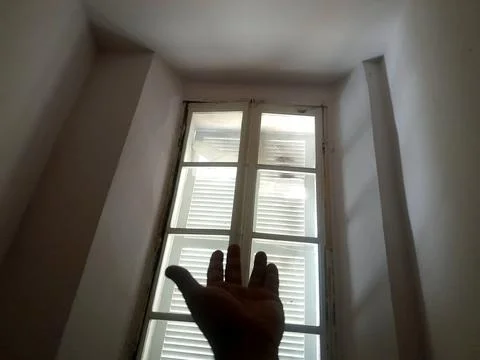 Window bright light feel by hand from room Stock Photos