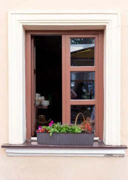 Window with brown frame and beige walls Stock Photos