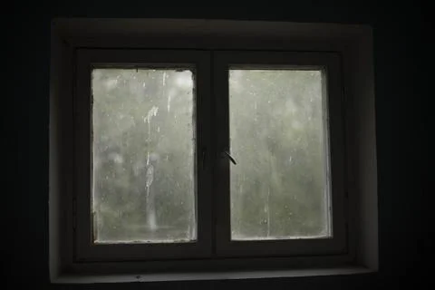 Window in building. Interior details. Window in dark room. Stock Photos
