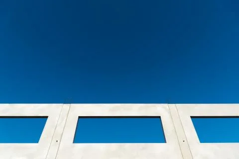 Window of a building shell with blue sky Stock Photos