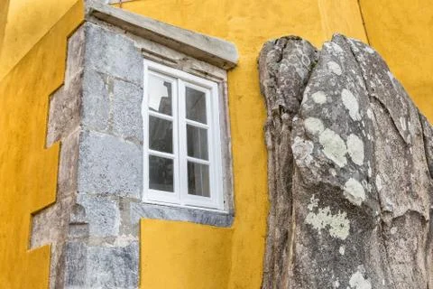 Window built into the stone mountain. The castle Pena Sintra Portugal. Stock Photos