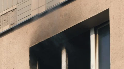 The window of a burning apartment. Fire in the building. Fire extinguishing Stock Footage 119601600