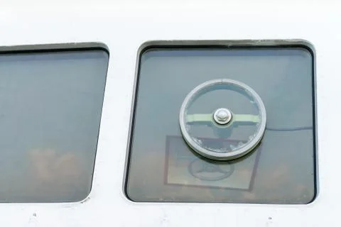 Window of captain's bridge on the big ship Stock Photos
