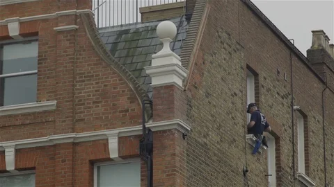 Window cleaner - high up on window ledge Stock Footage 93209000
