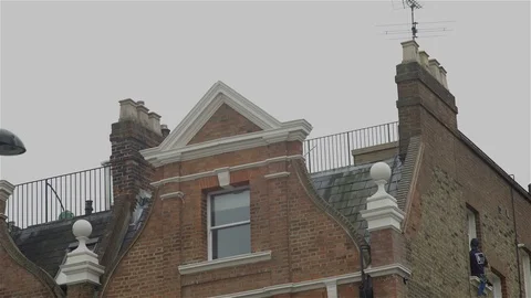 Window cleaner - high up on window ledge Stock Footage 93209015