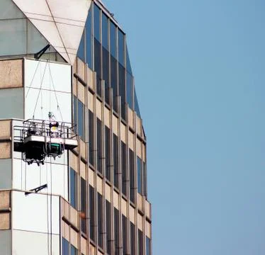 Window cleaner on skyscraper Stock Photos