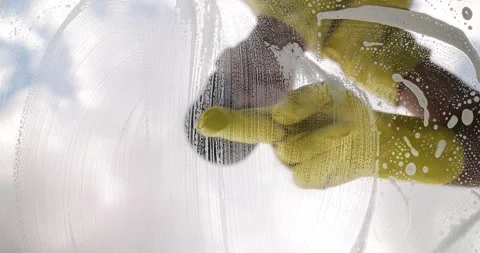 Window cleaner with sponge cleaning glass window, Cleaning conept image Stock Footage 190932784