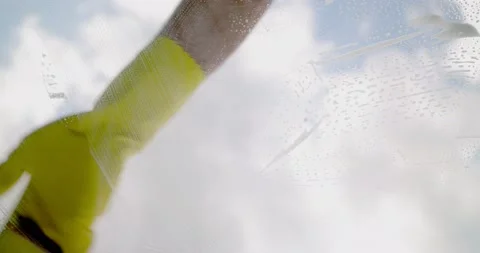 Window cleaner with sponge cleaning glass window, Cleaning conept image Stock Footage 195992646