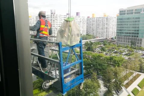 Window cleaner worker on high building Stock Photos
