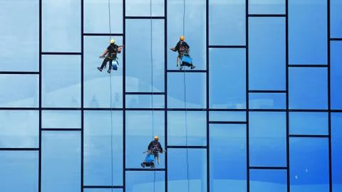 Window Cleaner at Working. Window cleaner, in the suspension system. Industri Stock Photos