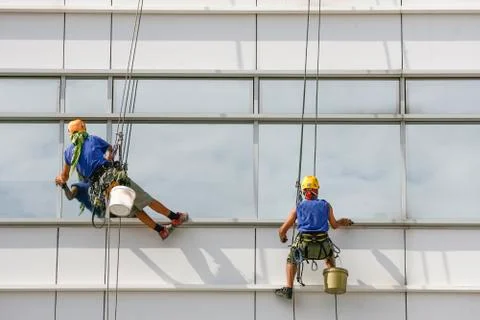 Window cleaners on a building Stock Photos