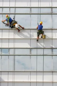 Window cleaners on a building Stock Photos