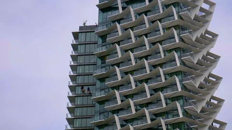 Window Cleaners coming down a modern funky building- 4K Stock Footage 131411340