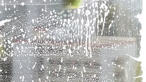 Window cleaning with a brush Stock Footage 240956162