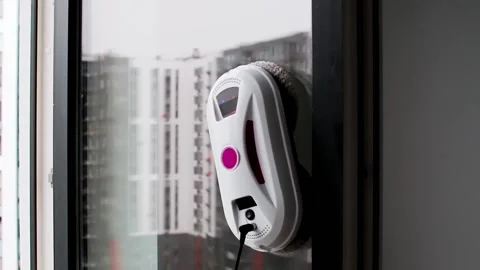 Window cleaning robot. Glass cleaning with technology and modern gadgets Stock Footage 221814029