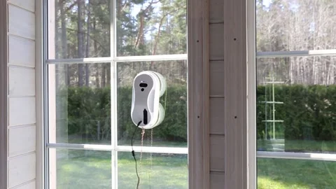 Window cleaning robot. Washing glass using technology in a modern home Stock Footage 238994829