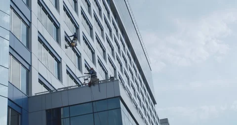 Window cleaning service works on the building Stock Footage 90579865