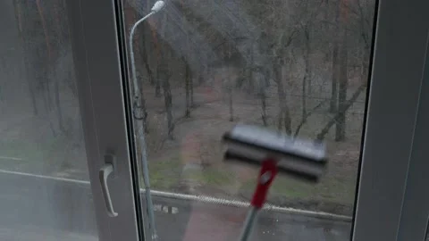 Window Cleaning Of Special Mop For Washing The Glass Surface Of Windows. Vídeos de archivo 235930292