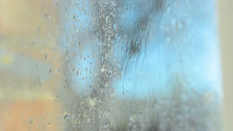 Window cleaning, spraying, water drips on the glass. Video stock 97968182