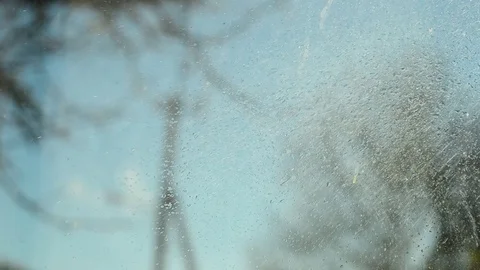 Window cleaning, spraying, water drips on the glass. Stock-Footage 97968783