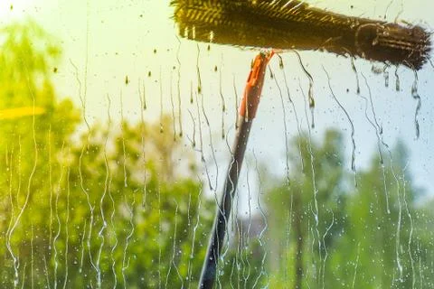 Window cleaning using telescopic water brush and wash system Stock Photos