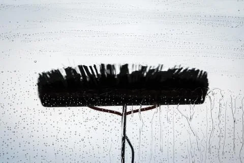 Window cleaning using telescopic water brush and wash system Stock Photos