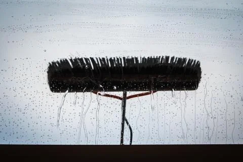 Window cleaning using telescopic water brush and wash system Stock Photos