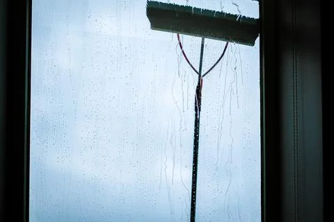 Window cleaning using telescopic water brush and wash system. Commercial window Stock Photos