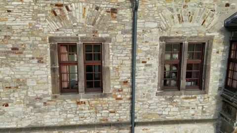 Window close up shifting toward historic bay detail Stock Footage 331209463