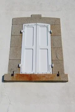 Window with closed shutter Stock Photos