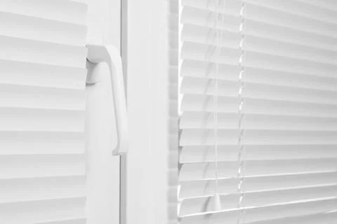 Window with closed white horizontal blinds indoors, closeup Photos