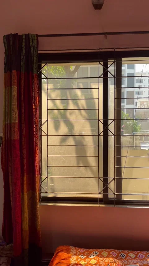 A window with colorful curtains Stock Footage 223906724