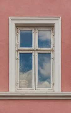 Window on the colorful facade Stock Photos