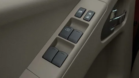 Window control buttons close up 2016 Nissan Frontier SV V6 Stock Footage 159859257