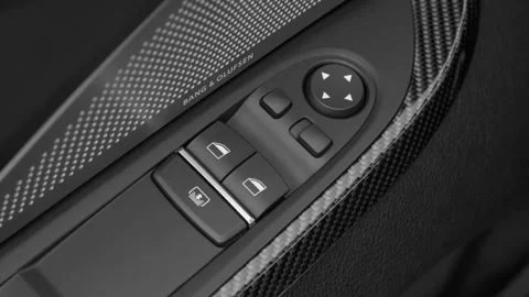 Window control buttons close up 2016 BMW 6-series M6 Stock Footage 159883421
