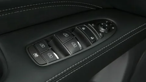 Window control buttons close up 2016 Infiniti QX60 Hybrid Stock Footage 159900304