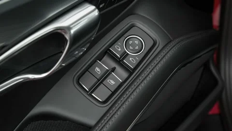 Window control buttons close up 2017 Porsche 911 Turbo Stock Footage 159893645
