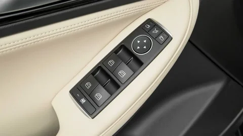 Window control buttons close up 2017 Infiniti QX30 Premium Stock Footage 159915956