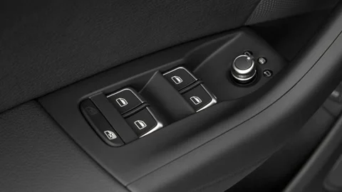 Window control buttons close up 2017 Audi Q3 Premium 2.0 TFSI Stock Footage 159919454