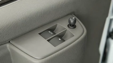 Window control buttons close up 2017 GMC Savana 3500 Passenger Extended 1LT Stock Footage 159923186