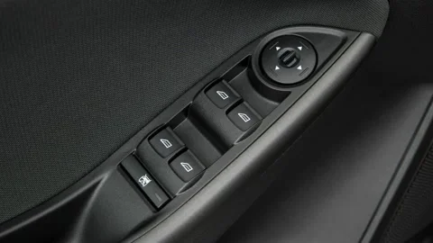 Window control buttons close up 2017 Ford Focus SEL Stock Footage 159925651