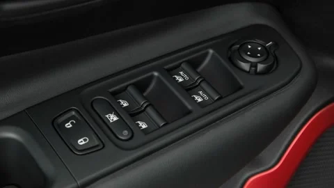 Window control buttons close up 2017 Jeep Renegade Trailhawk Stock Footage 159932556