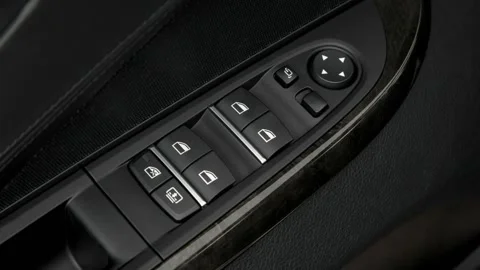 Window control buttons close up 2018 BMW 6-series 650i Gran Coupe Stock Footage 159958978