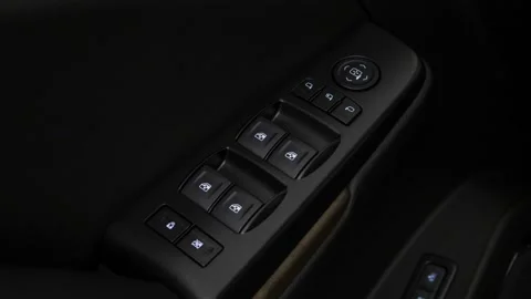 Window control buttons close up 2018 GMC Yukon XL Denali Stock Footage 159974570