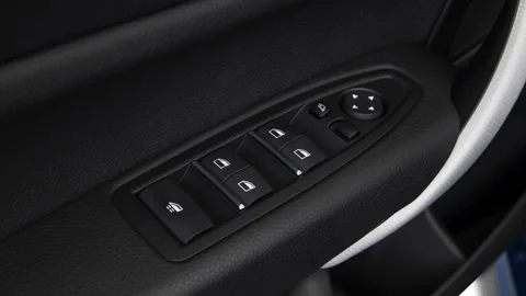 Window control buttons close up 2018 BMW 2-series M240i Stock Footage 159999284
