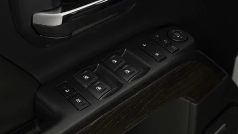 Window control buttons close up 2019 GMC Sierra 2500HD Denali Stock Footage 160018991