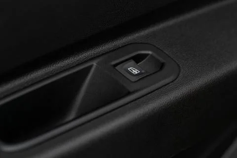 Window control buttons in modern car. Car window control panel. Modern car wi Stock Photos