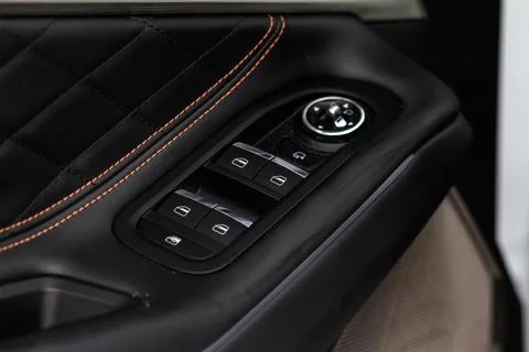 Window control buttons in modern car. Car window control panel. Modern car wi Stock Photos